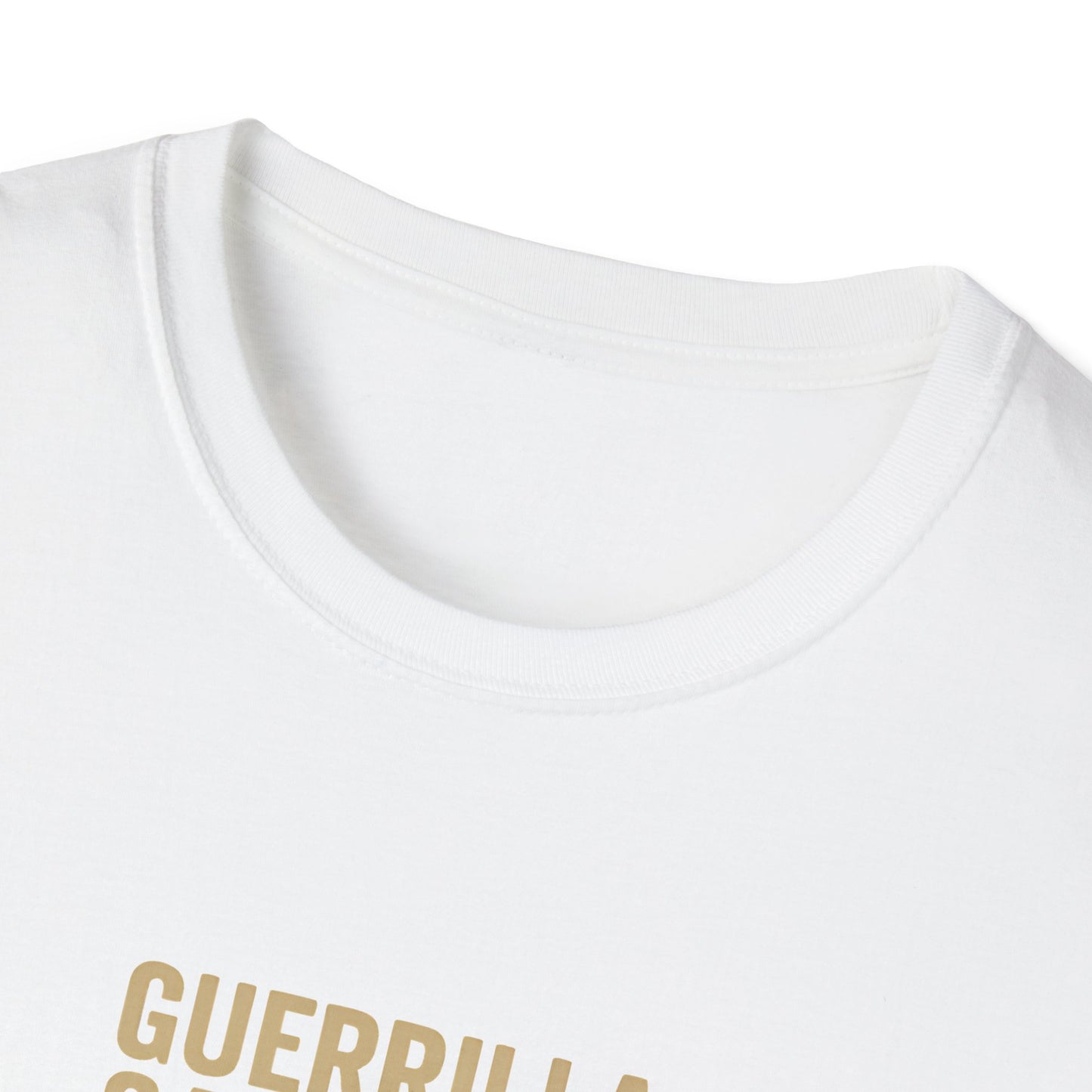 Close-up of a white t-shirt with 'GUERRILLA' printed in gold on a white background