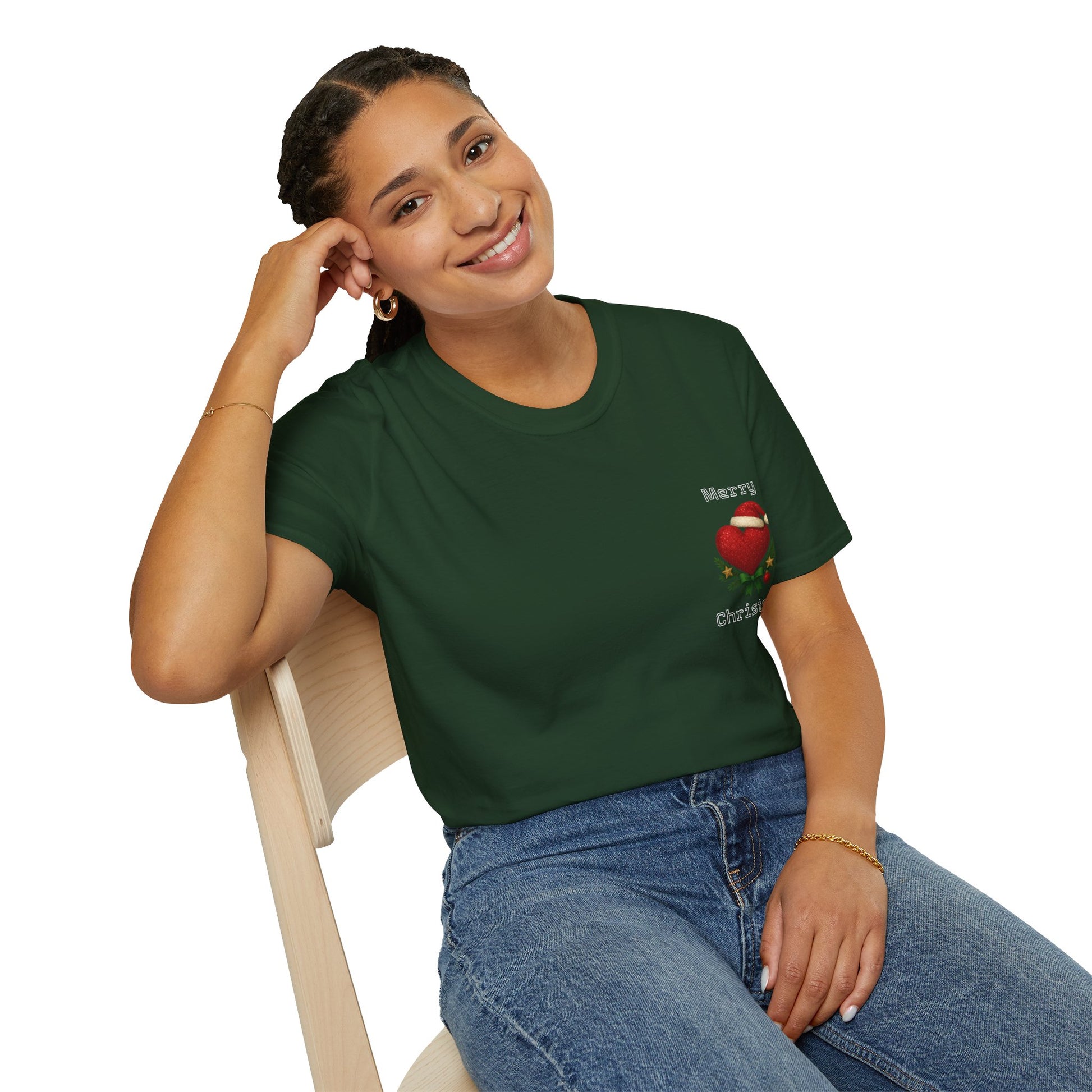 Woman wearing a green t-shirt with a christmas logo, sitting on a chair against a white background