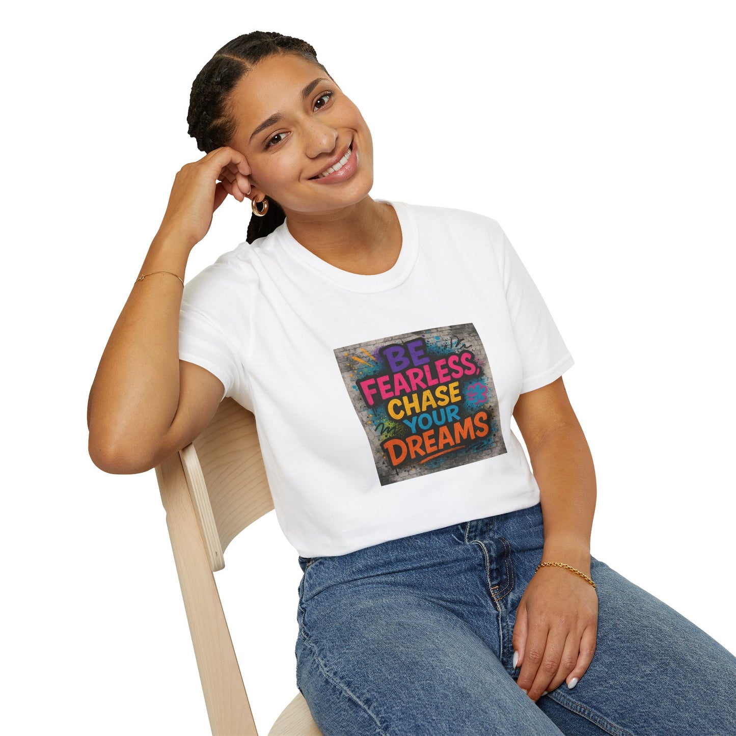 Person wearing a white t-shirt with motivational quote sitting on a chair.