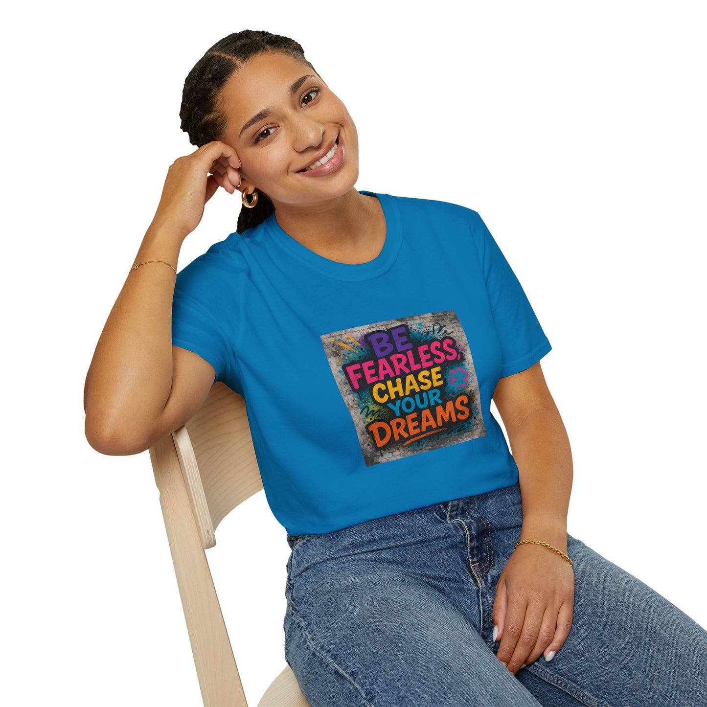 Person wearing a blue t-shirt with motivational quote sitting on a chair.