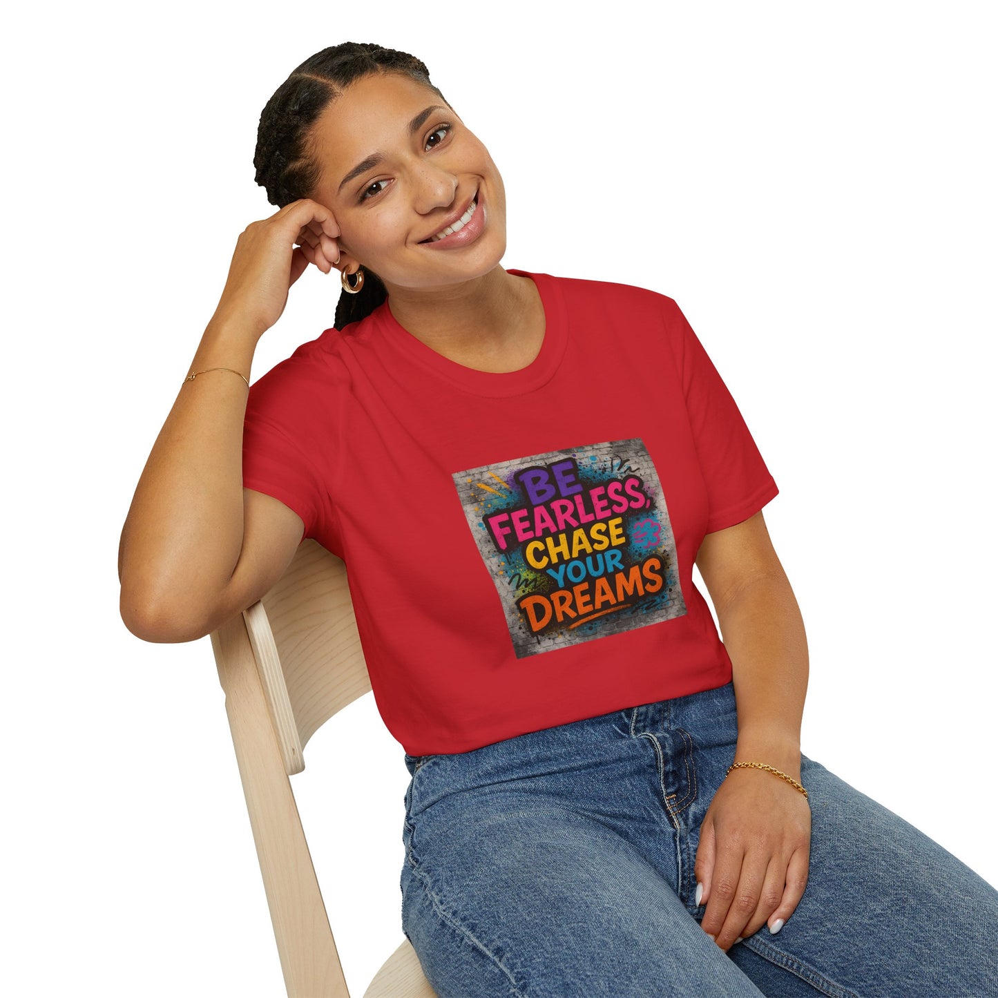 Person wearing a red t-shirt with motivational quote sitting on a chair.