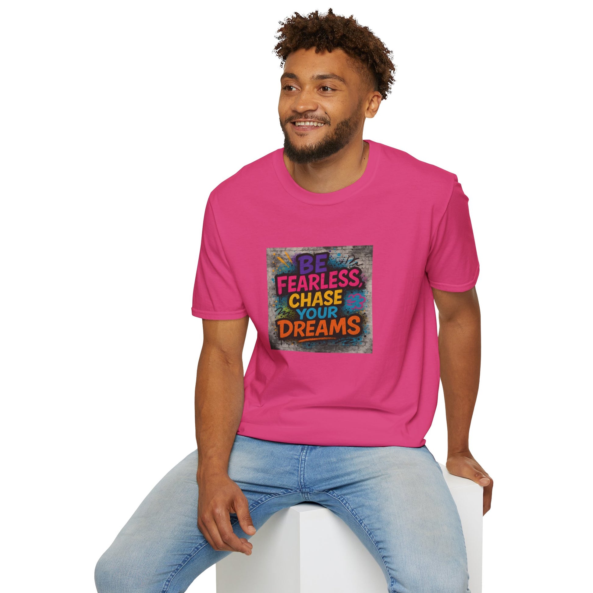 Man wearing a pink t-shirt with motivational quote on a white background