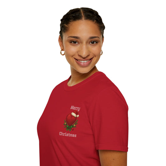 Person wearing a red 'Merry Christmas' t-shirt with a heart design on a white background