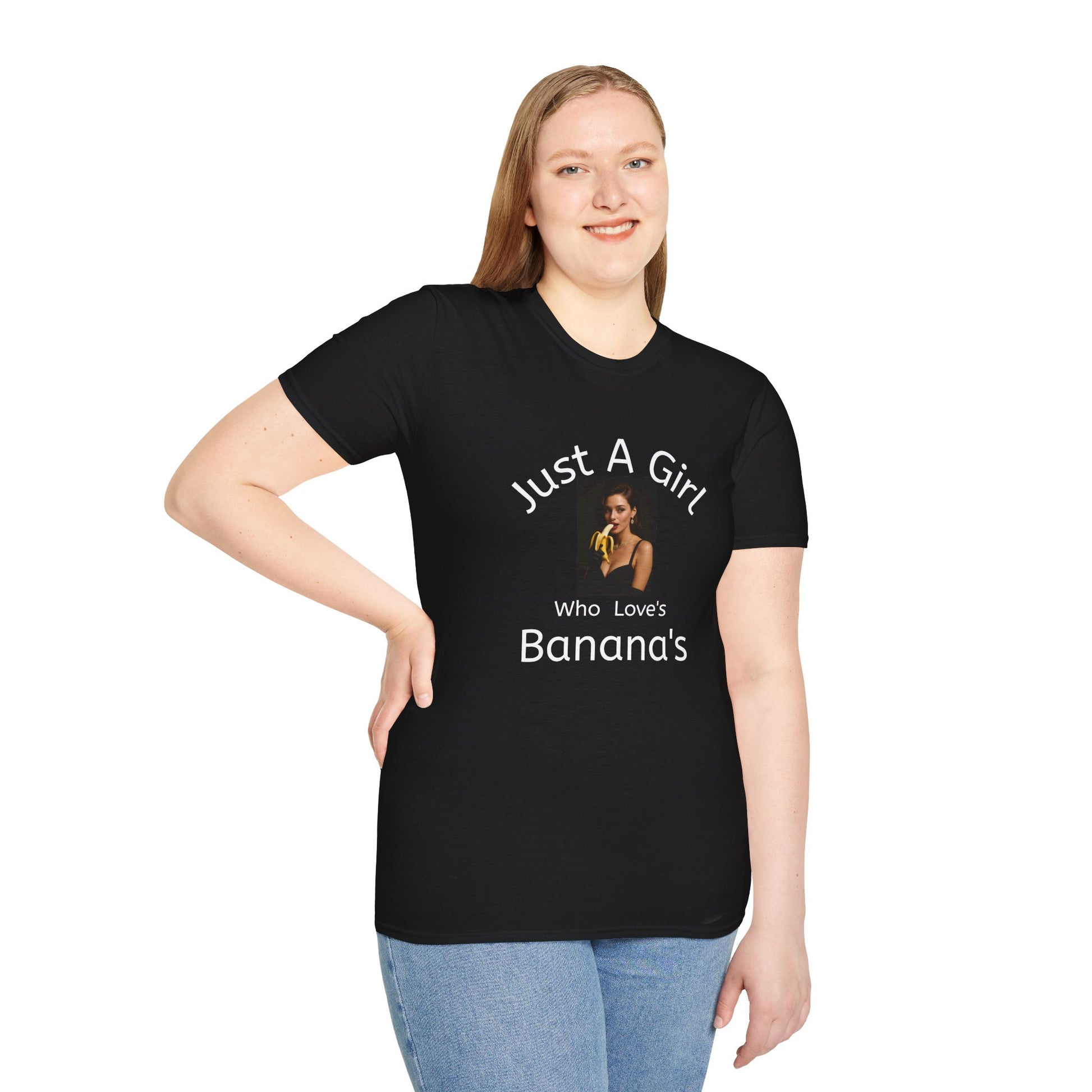 Person wearing a black t-shirt with text and a graphic of a woman eating bananas on a white background