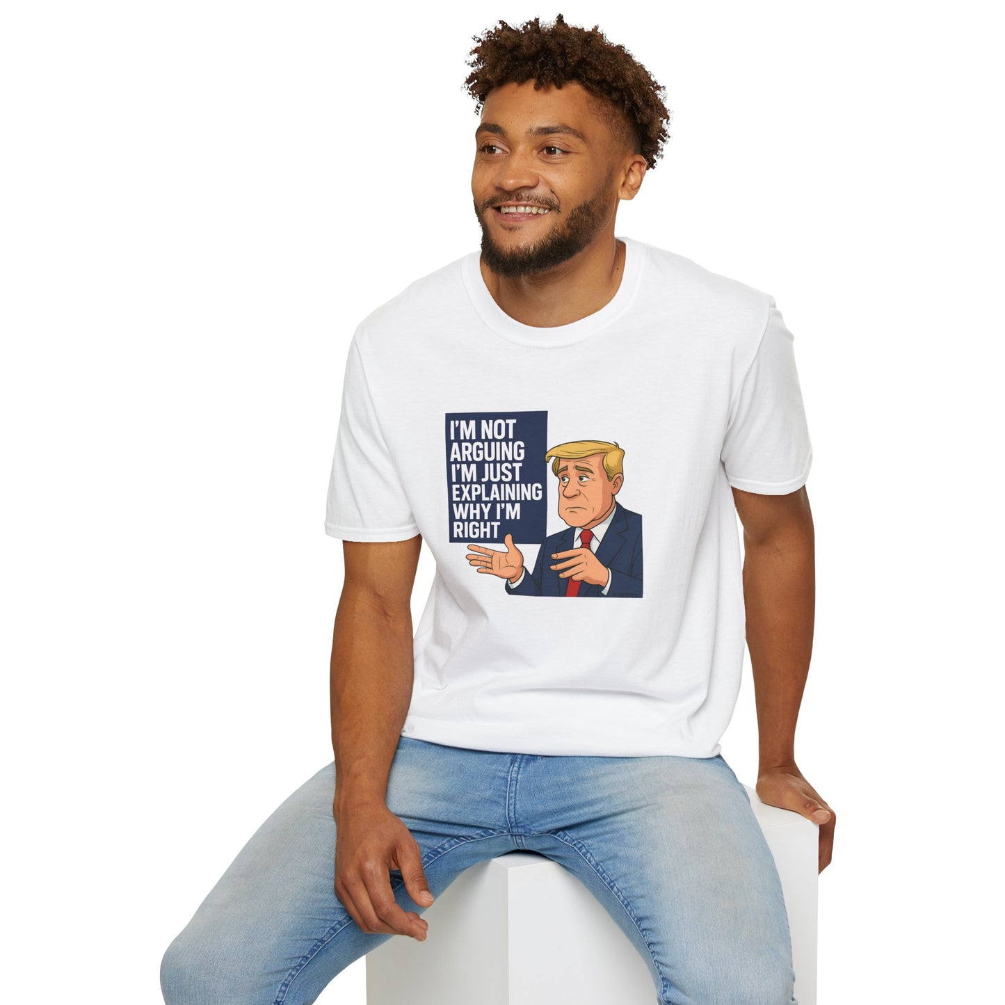 Man wearing a white t-shirt with a graphic and text, sitting on a white stool against a white background.