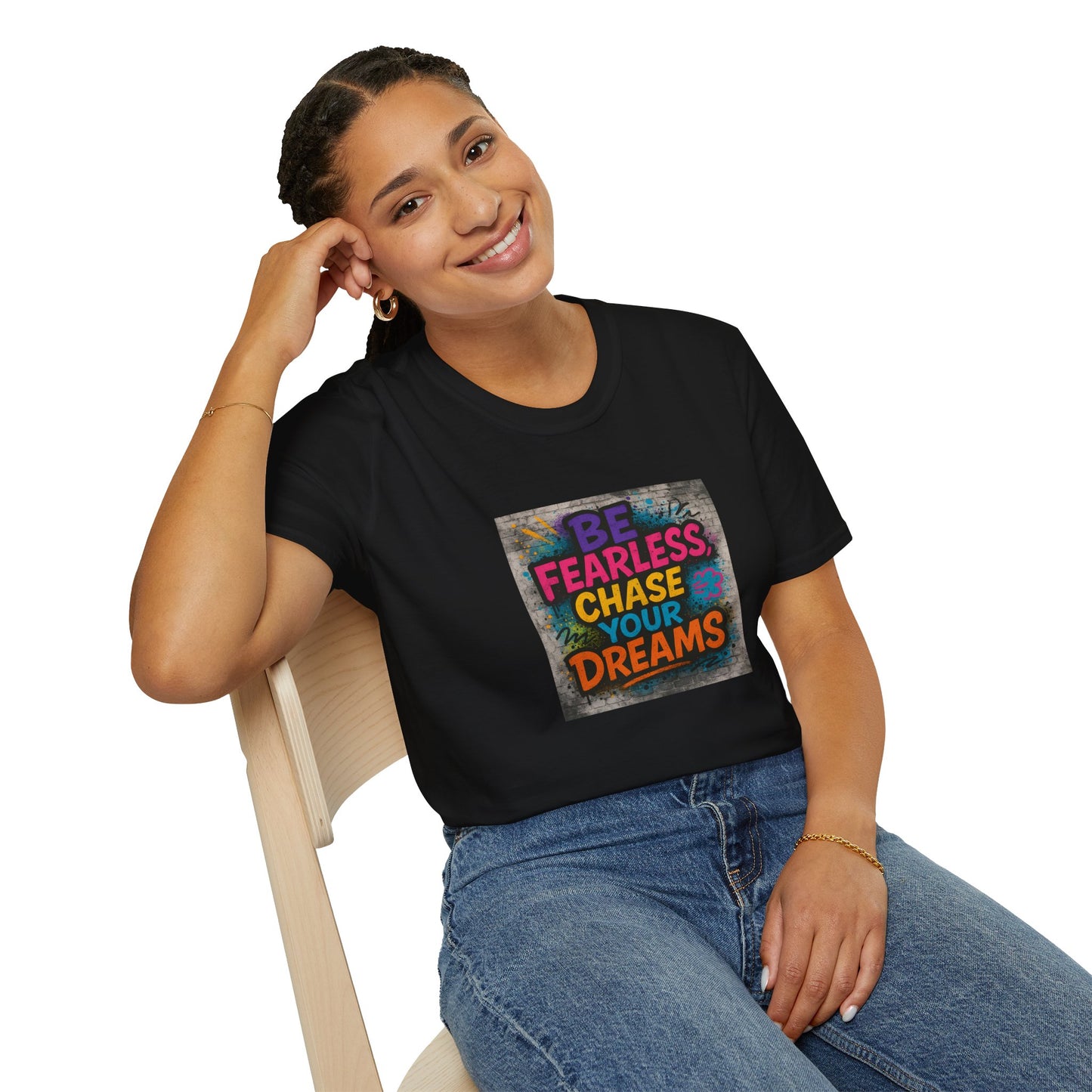 Person wearing a black t-shirt with colorful text and graphic design.