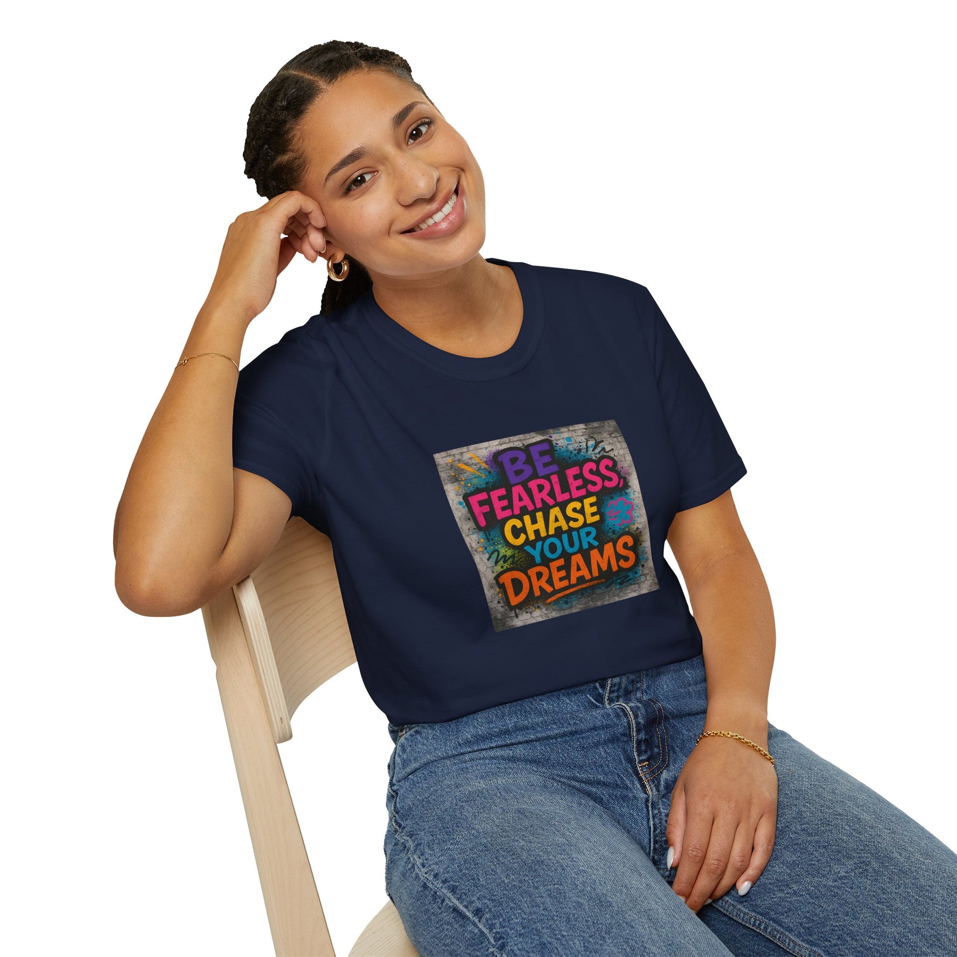 Person wearing a navy blue t-shirt with motivational quote, sitting on a white background