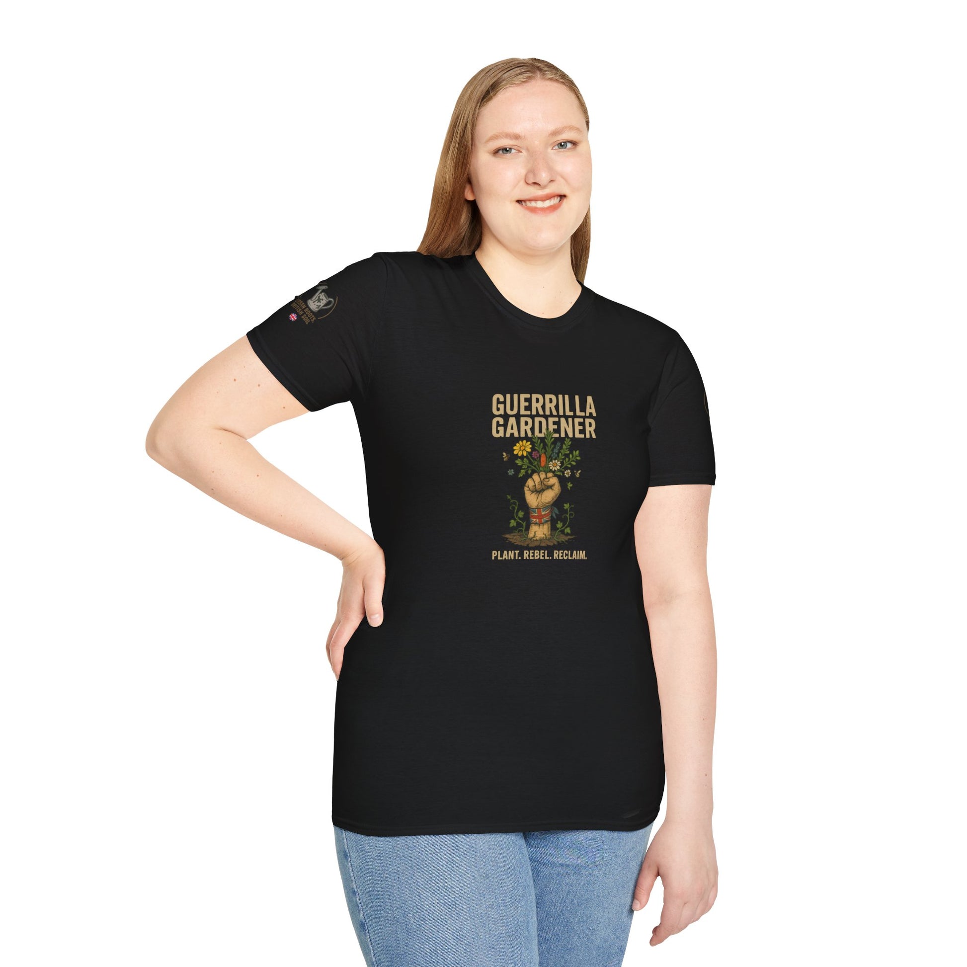 Person wearing a black t-shirt with 'Guerrilla Gardener' graphic design on a BLACK background