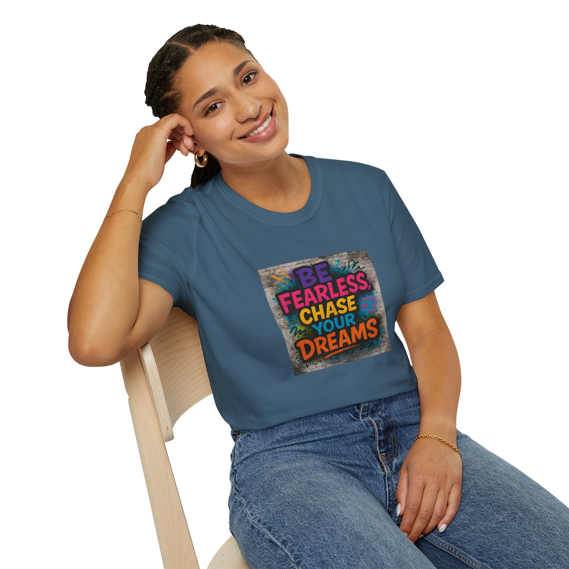 Woman wearing a blue t-shirt with motivational quote sitting on a chair.