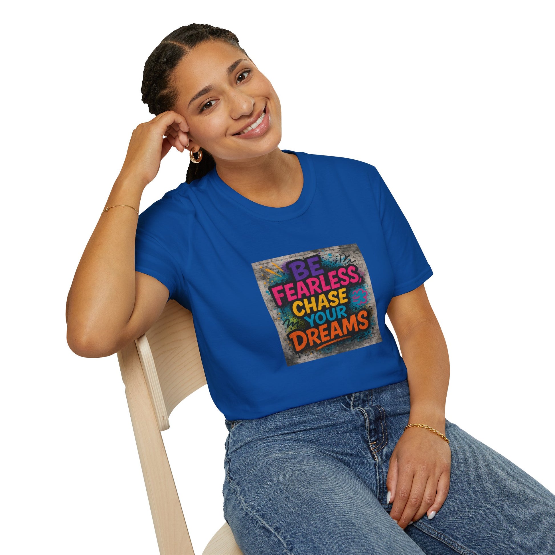 Person wearing a blue t-shirt with motivational quote sitting on a chair.