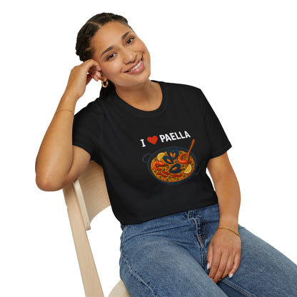 Woman wearing a black t-shirt with 'I love Paella' design sitting on a chair.