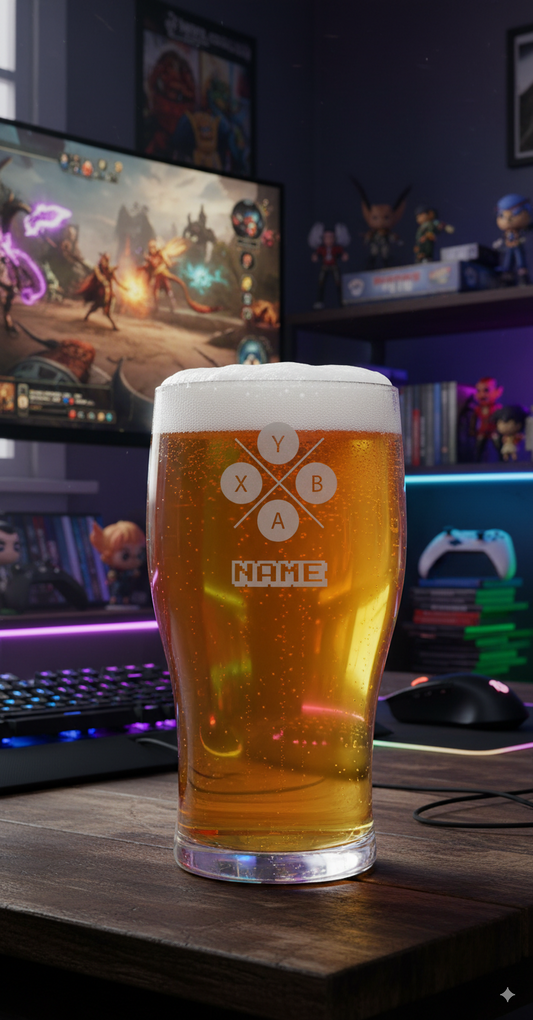 Glass of beer with a gamer logo on a desk in front of a computer screen displaying a game. personalise with name