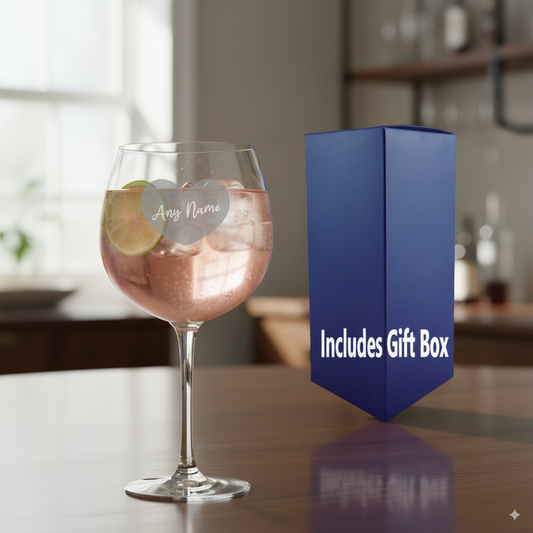 Personalised Heart Gin glass with a drink 'Includes Gift Box' on a table.