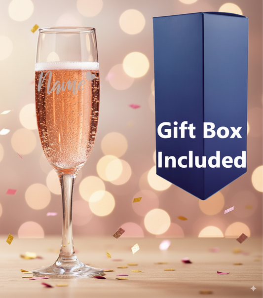 Personalised Heart Champagne flute with rose gold champagne, and a blue gift box labeled 'Gift Box Included' on a festive background.