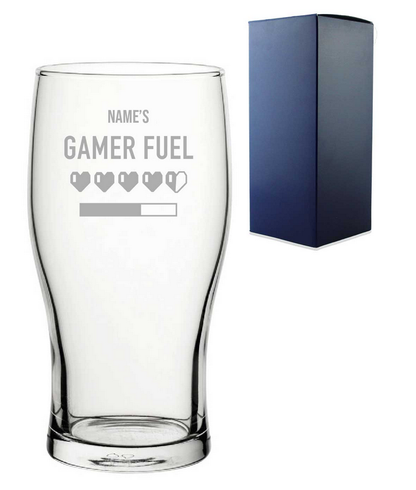 Clear glass with 'Gamer Fuel' text and  hearts design, next to a blue  gift box on a white background