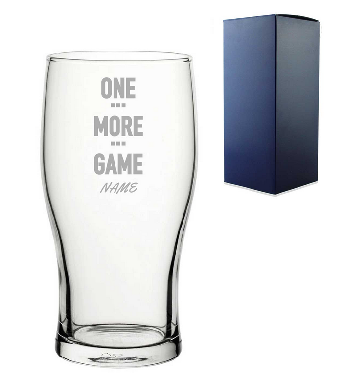 Clear glass with engraved text and a blue gift box on a white background