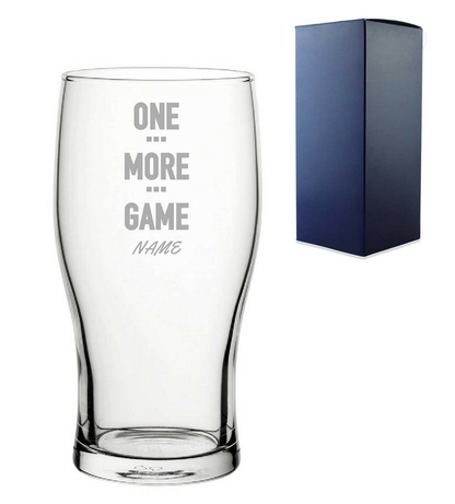 Clear glass with engraved text and a blue gift box on a white background