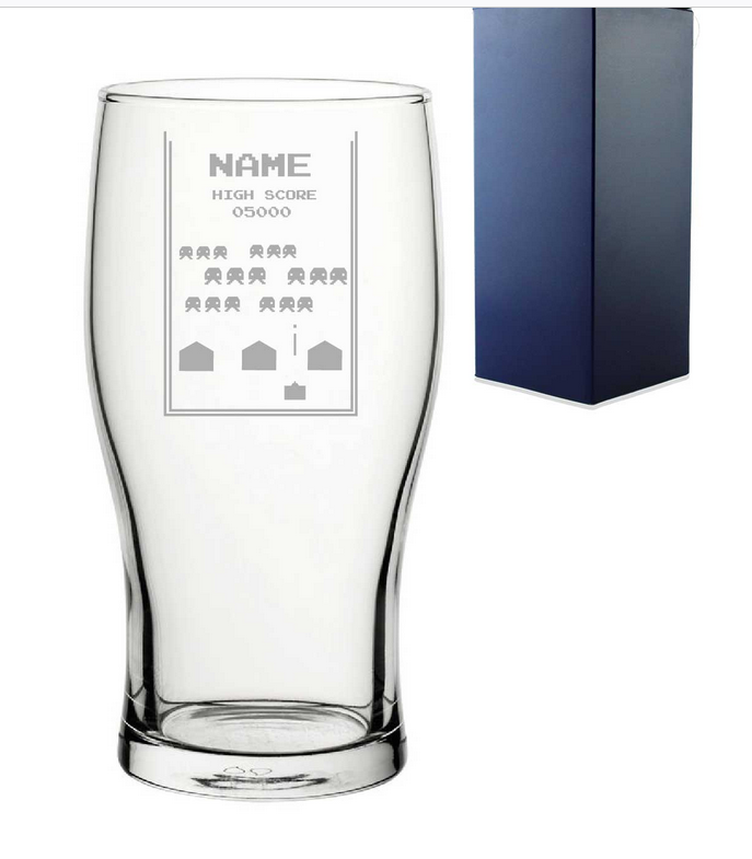 Clear pint glass with personalised space arcade game engraved design and a blue gift box in the background